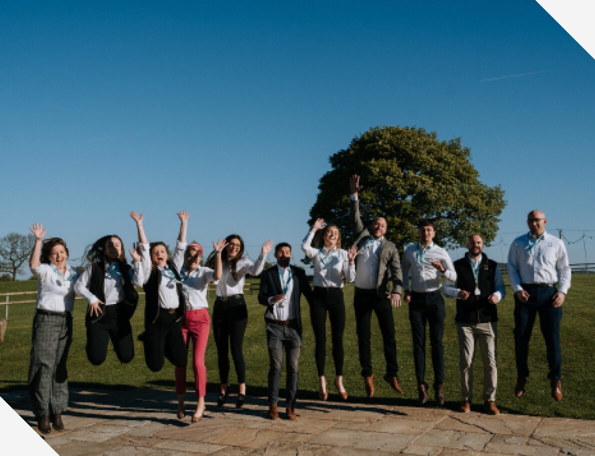 The Hillsgreen team jumping in a field
