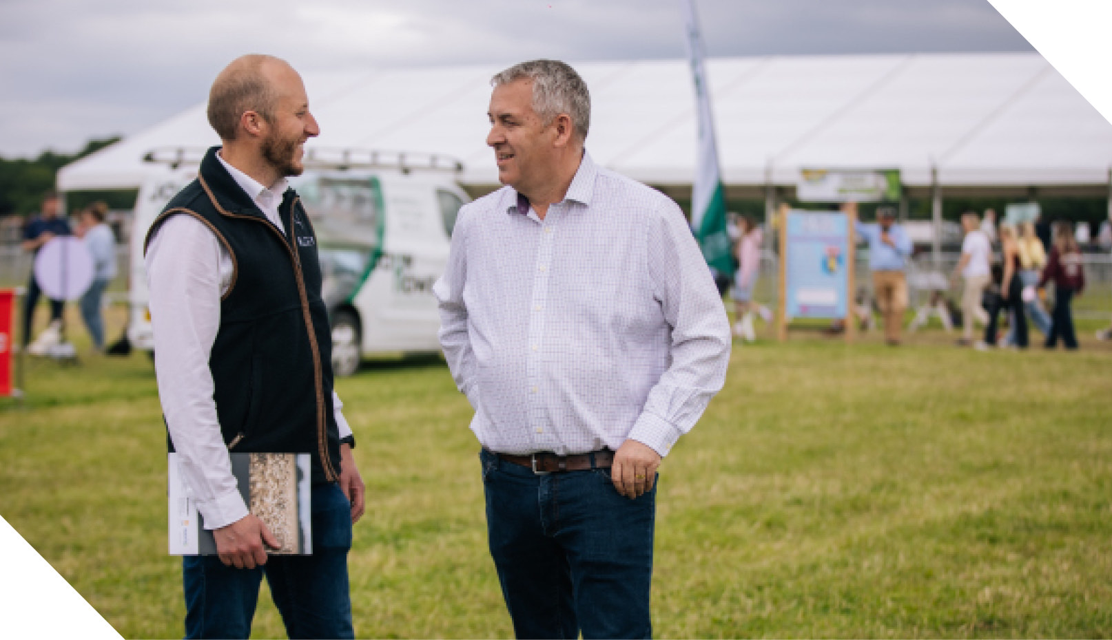 Two colleagues talking at a show